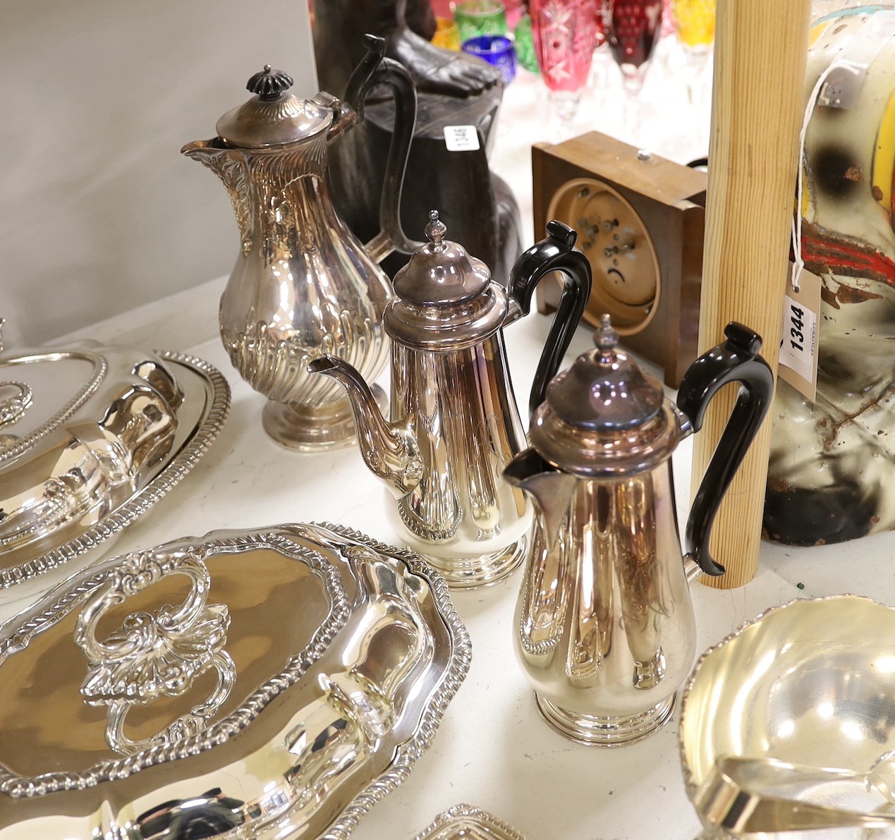 A large quantity of plated wares including two entree dishes and covers, a three-piece tea set etc.